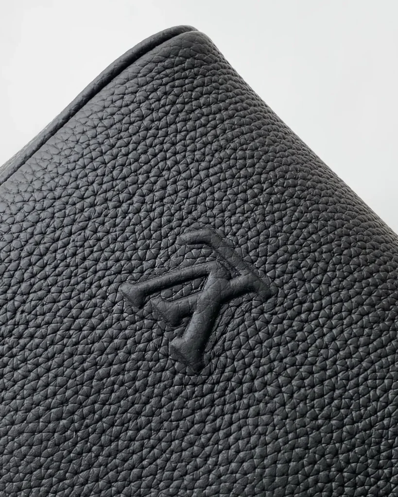 Black Grained-Look Duffle Bag — logo detail view