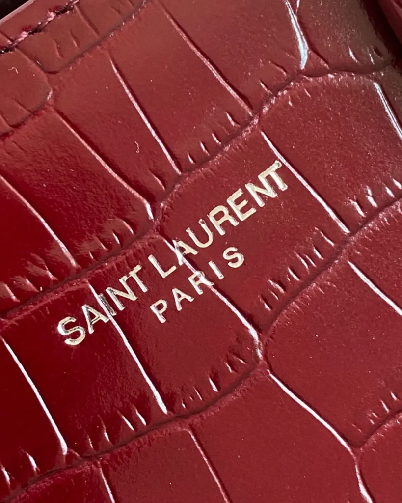 Burgundy Embossed Accordion Tote — logo detail view