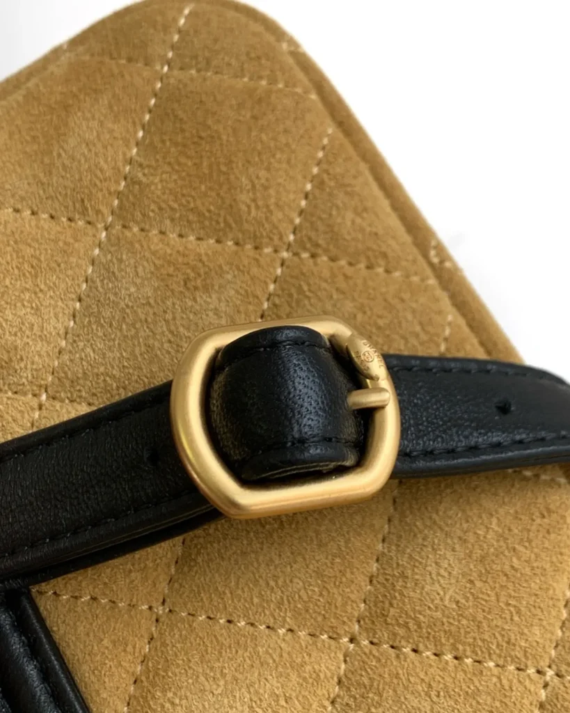 Tan and Black Quilted Flap Shoulder Bag — strap buckle view