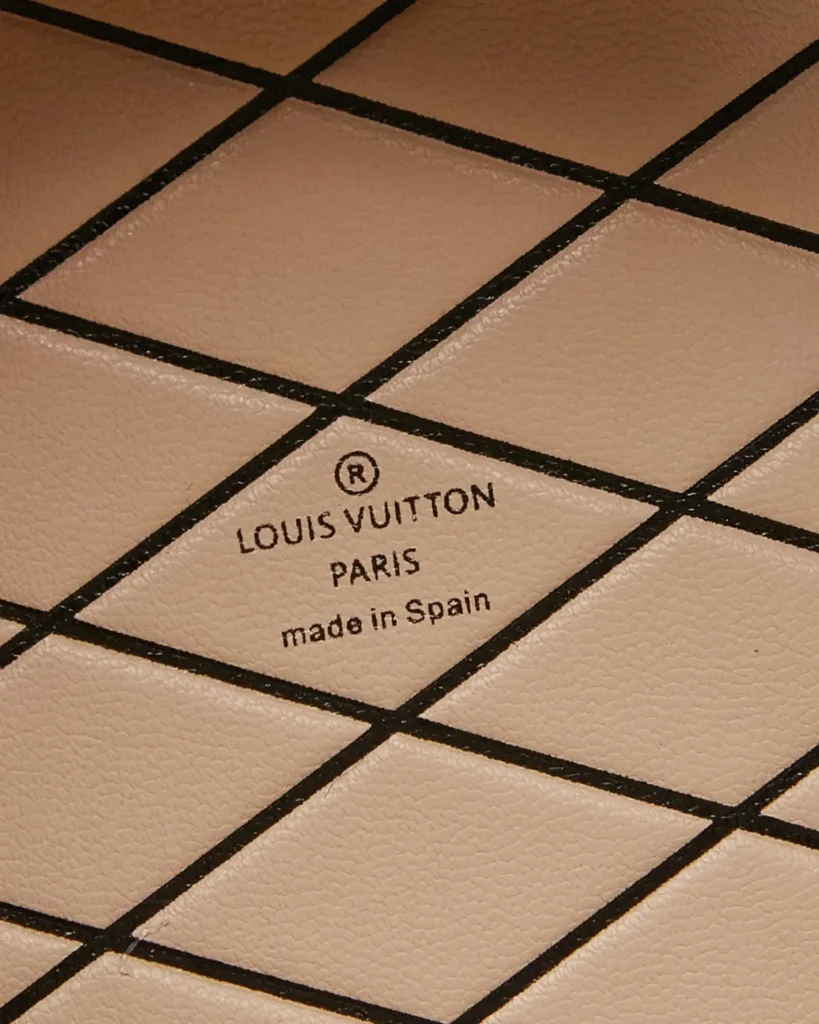 Brown Monogram Round Crossbody Bag — interior lettering view