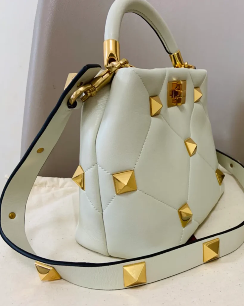 Ivory Diamond-Quilted Studded Top-Handle Bag — side view