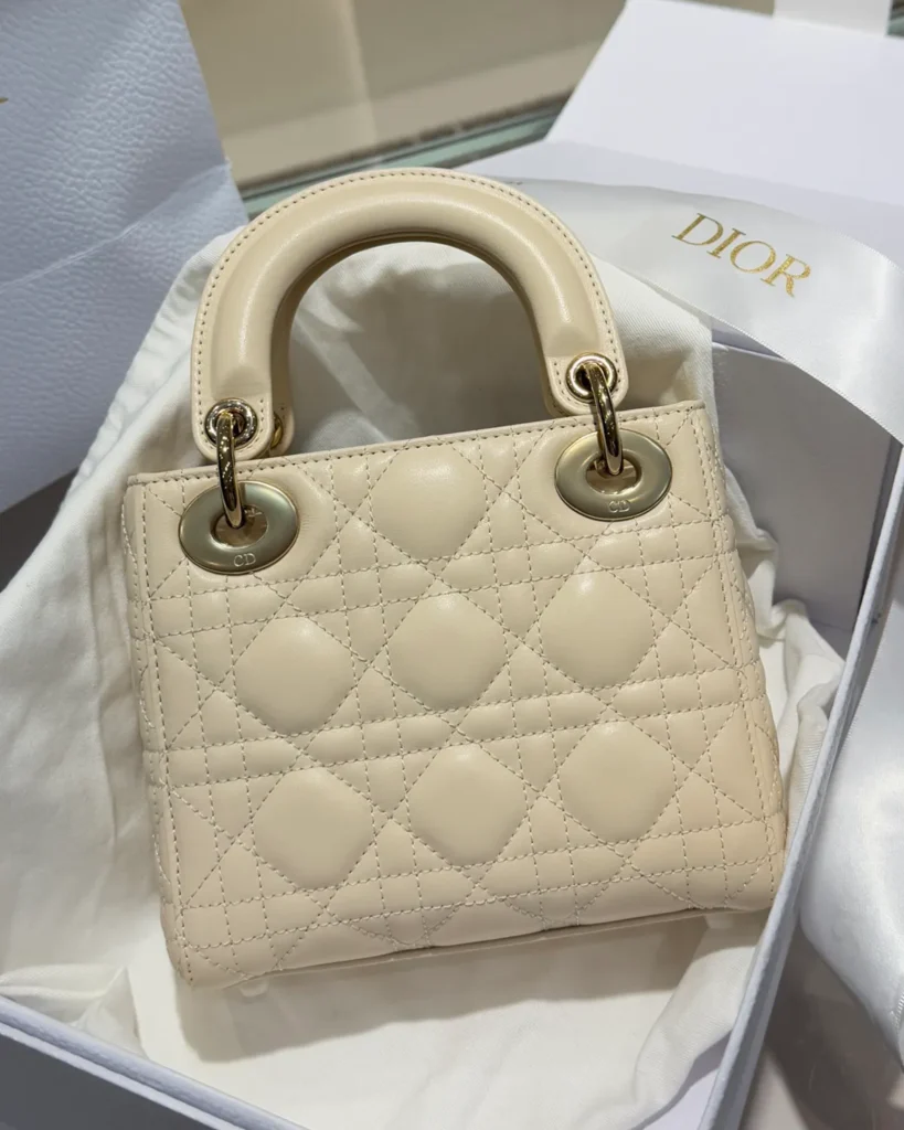 Cream Quilted Top Handle Bag with Sparkling Charms — rear view
