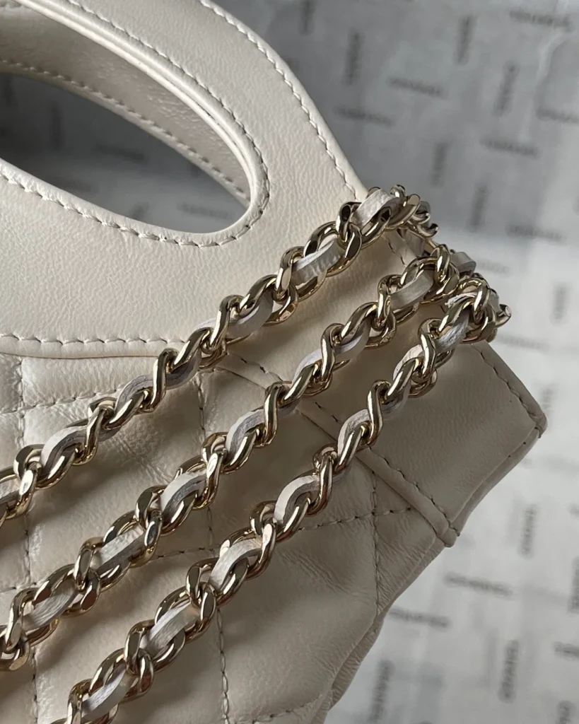 Ivory Quilted Cutout-Handle Tote — chain detail view