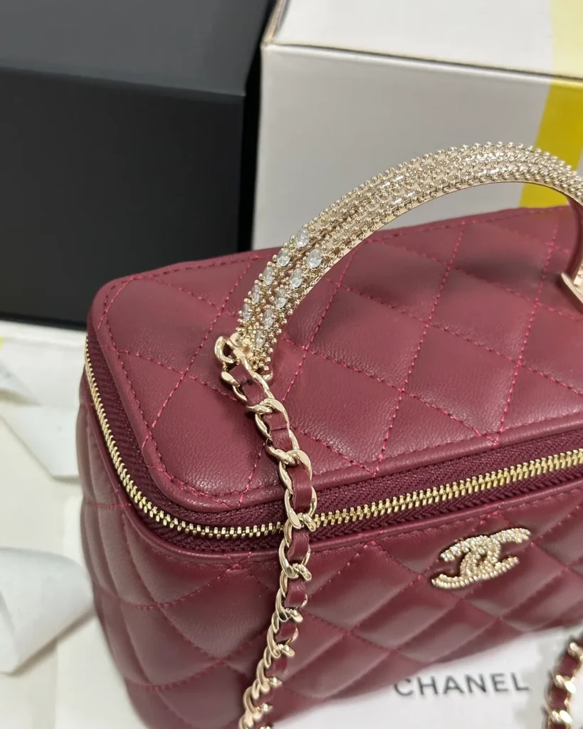Burgundy Quilted Ornamental-Handle Vanity Bag — zipper detail view