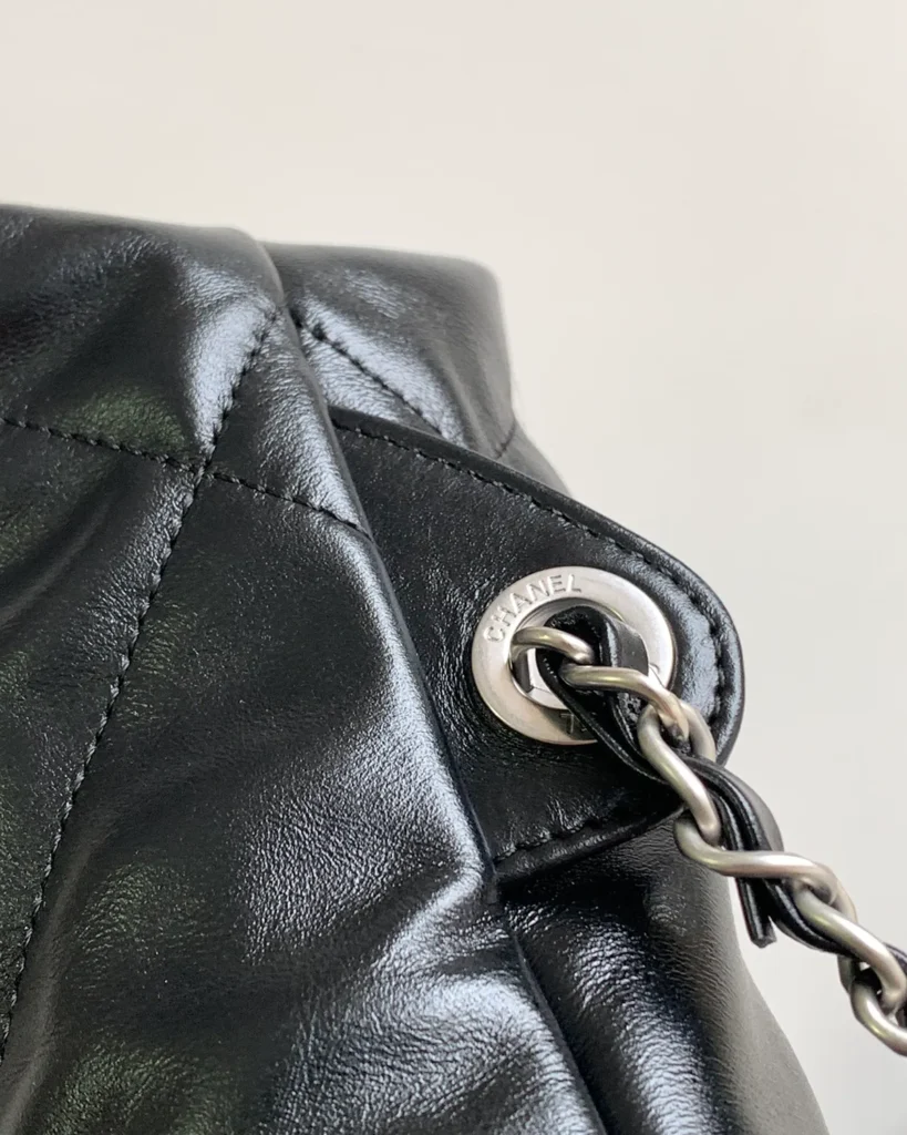 Glossy Black Quilted Gathered Tote — attachment detail view