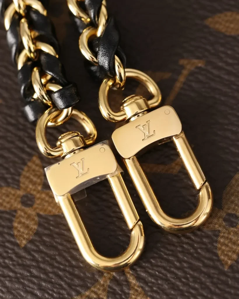 Brown Monogram Vanity Case with Padlock — chain clips view