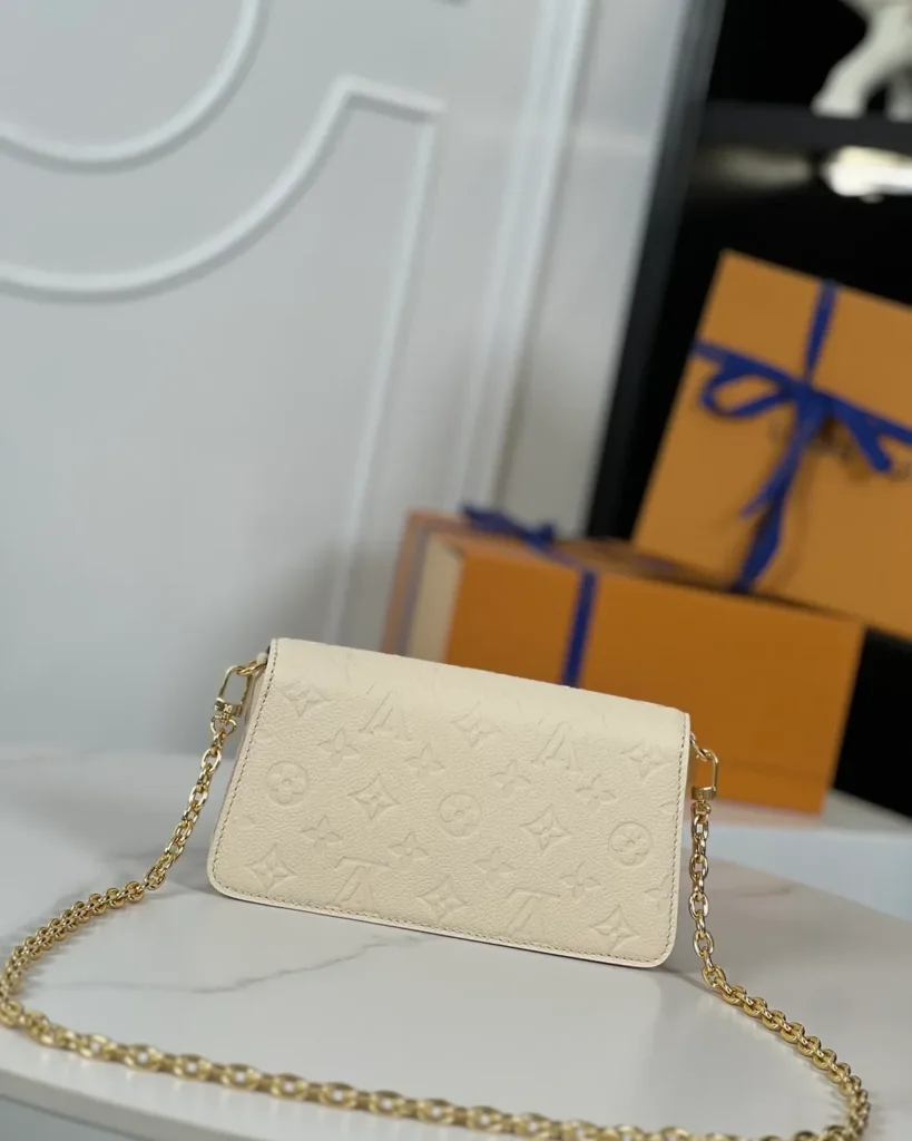 Cream Embossed Flap Chain Wallet — rear view
