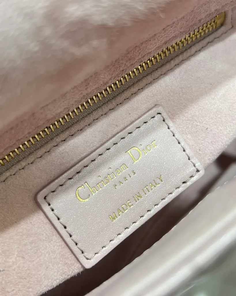 Pearlescent Pink Quilted Top Handle Bag — interior zipper view