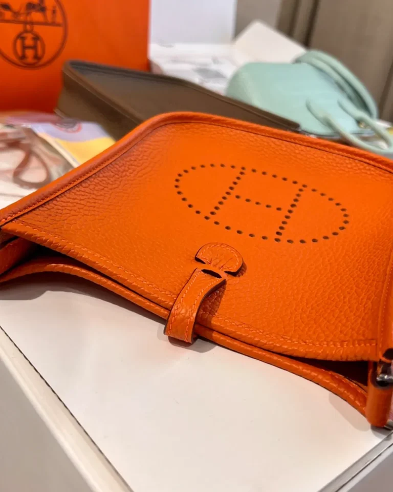 Evelyne-Inspired Mini Orange Crossbody Bag, front laid flat