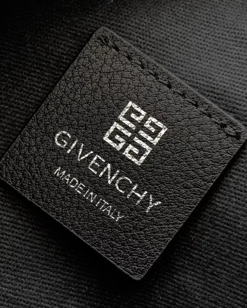 Black Draped-Top Buckle Shoulder Bag — label detail