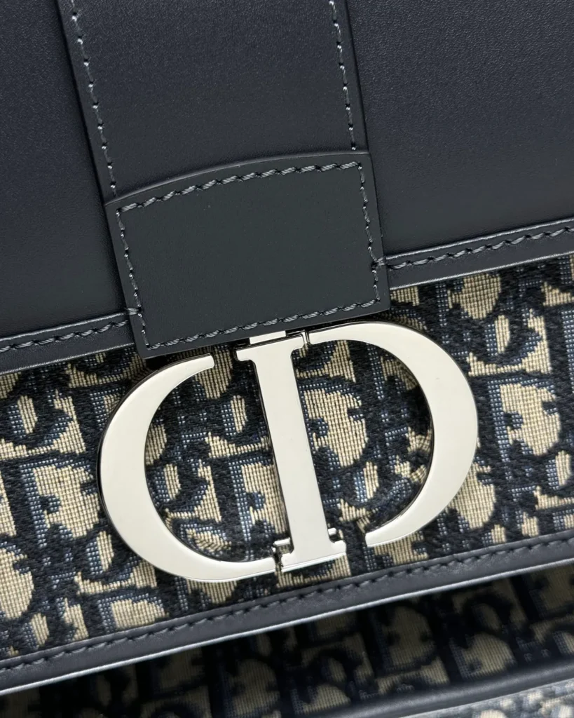 Navy Monogram Box Flap Bag — clasp detail view