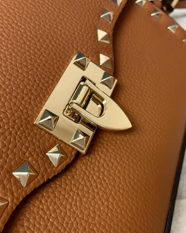 Tan Studded Edge Flap Shoulder Bag — closure detail view