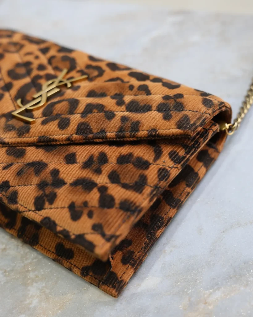 Leopard Print Envelope Chain Wallet — emblem detail view