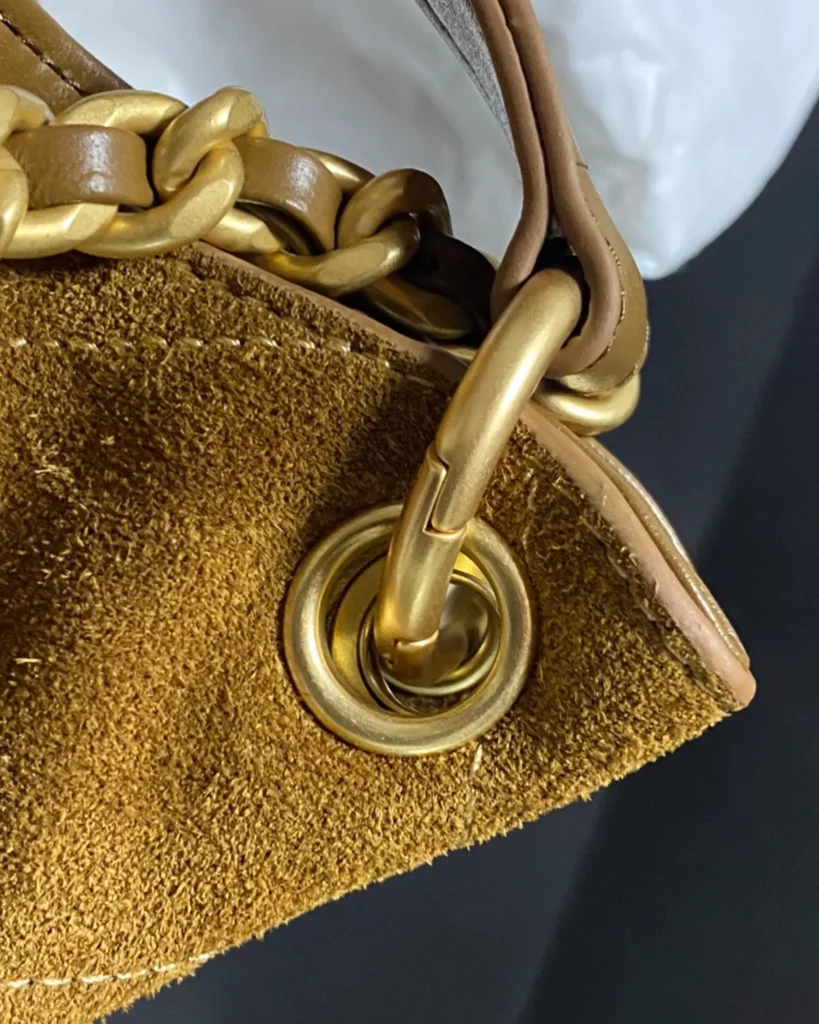 Brown Diamond-Stitched Chain Hobo Bag — chain detail view