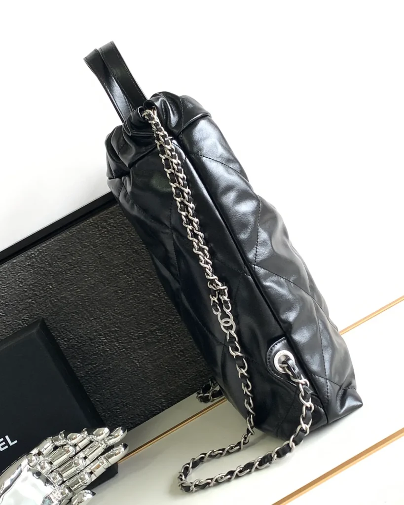 Glossy Black Quilted Gathered Tote — side view