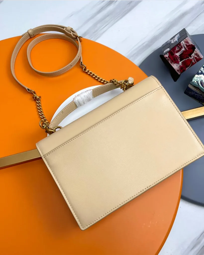 Cream Top-Handle Accordion Flap Bag — rear view