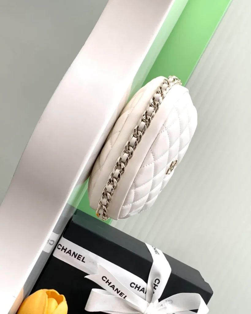 Ivory Quilted Round Chain-Edge Bag — side angle view