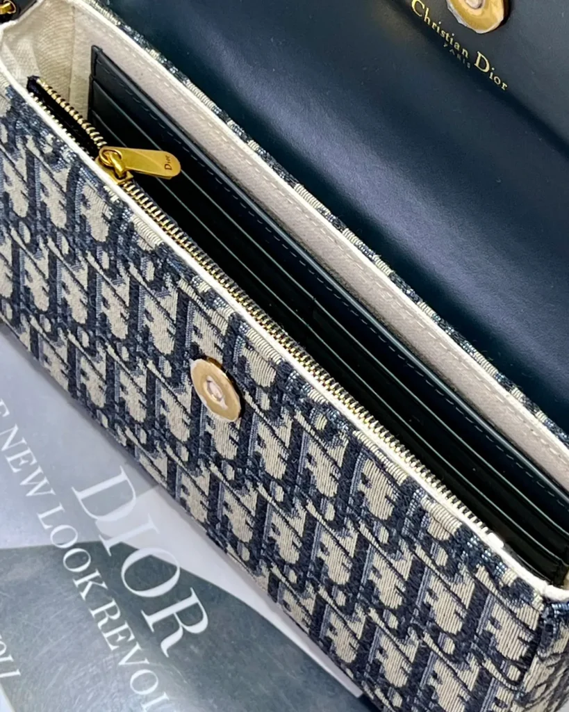 Navy Monogram Asymmetric Chain Pouch — interior detail view