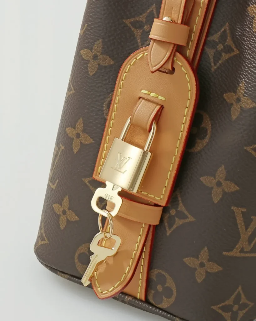 Brown Monogram Curved Top Bucket Bag — padlock view