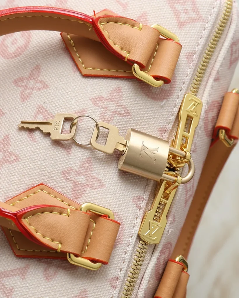 Pink Cream Monogram Boston Bag — zipper padlock view