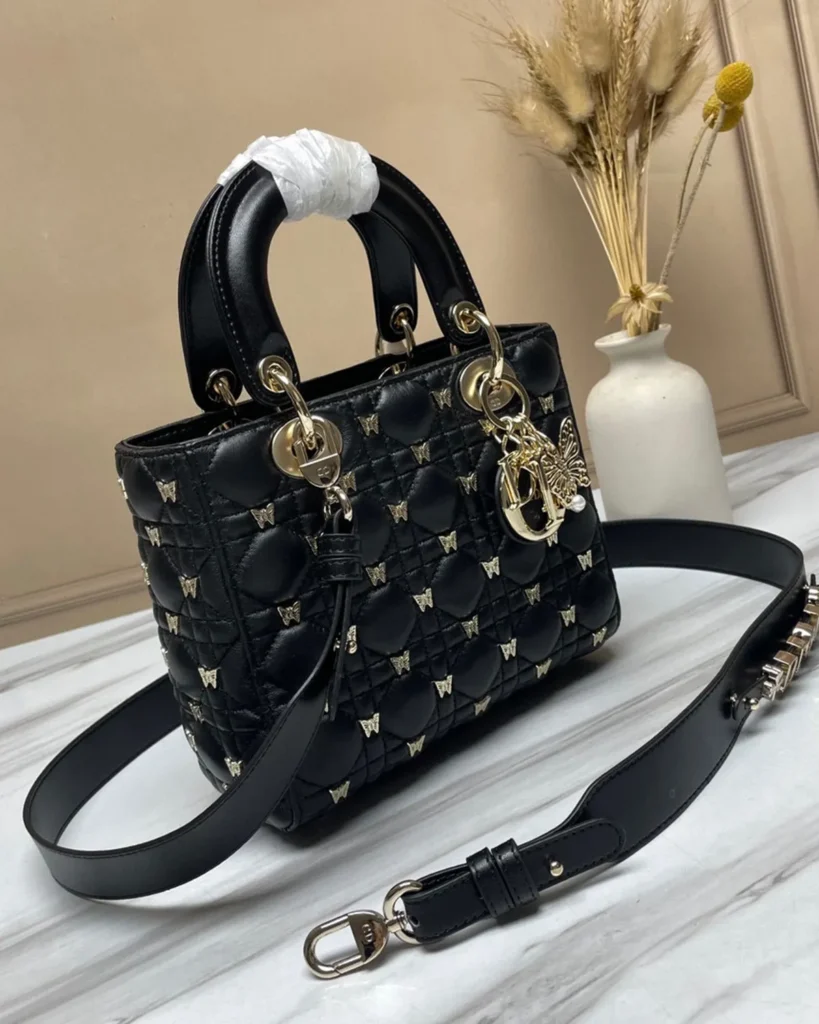 Black Butterfly-Embellished Top Handle Bag — angled front view