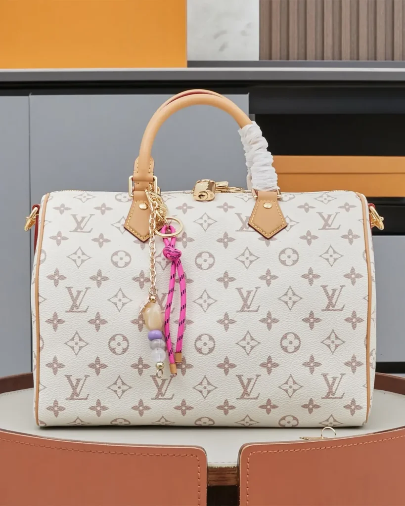 Cream Monogram Top-Handle Bag with Colorful Charms — front view