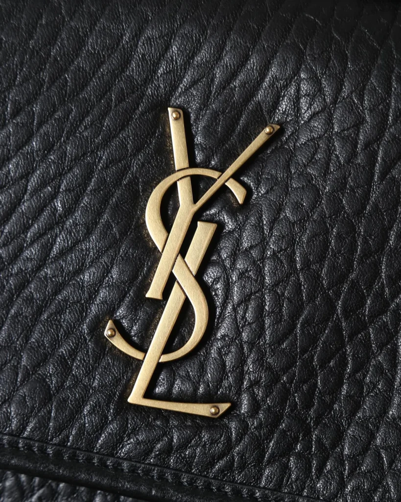 Black Pebbled Flap Chain Bag — emblem view