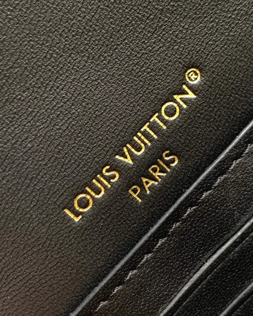 Black Quilted Chain Flap Bag — interior lettering view