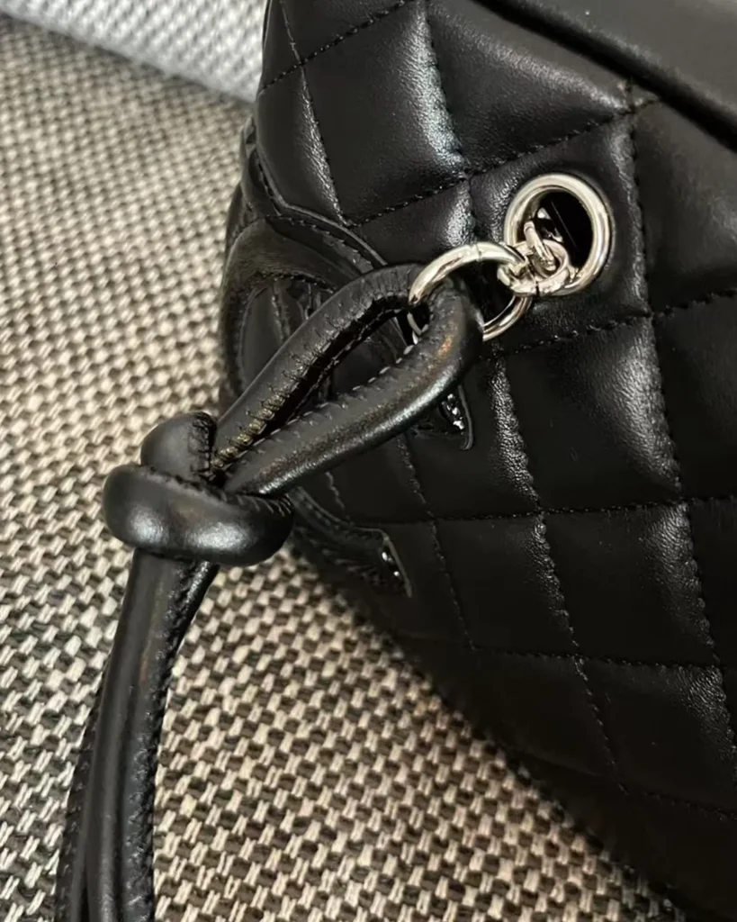 Black Quilted Offset-Emblem Bowler Bag — attachment detail view
