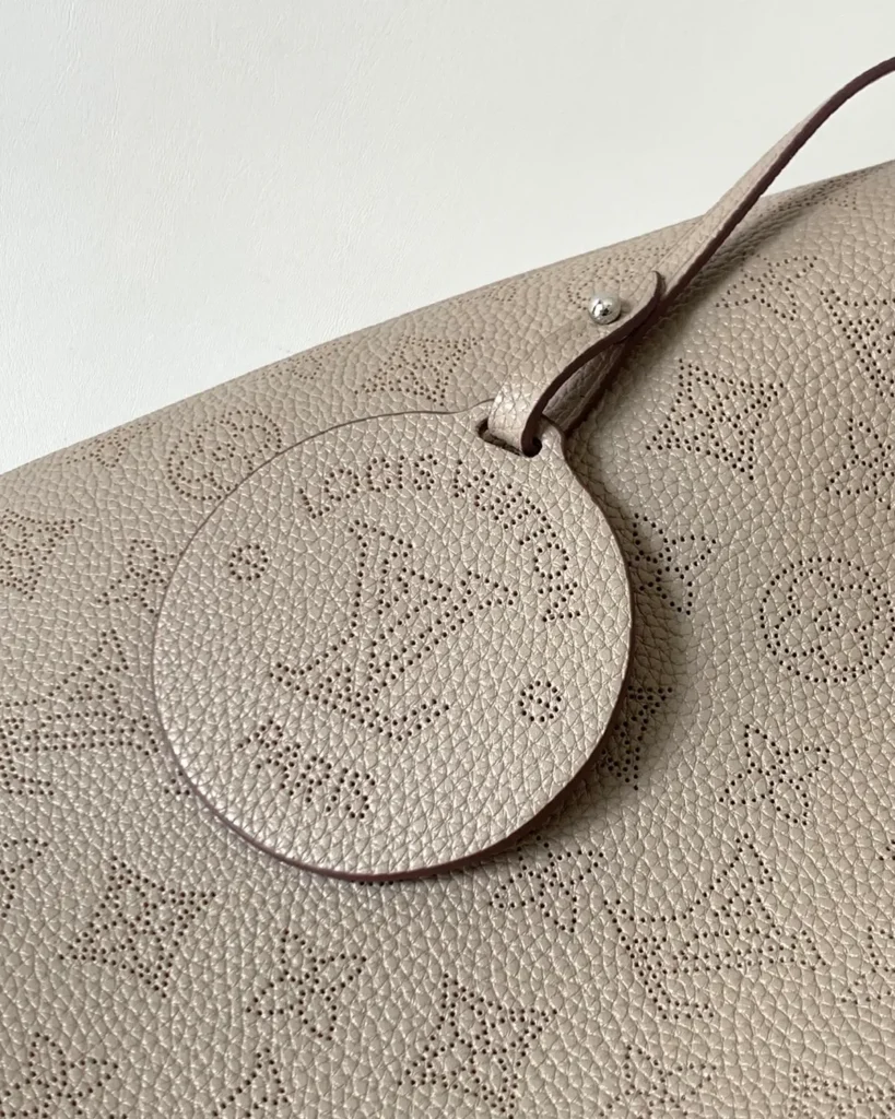 Taupe Perforated Monogram Shoulder Bag — charm view