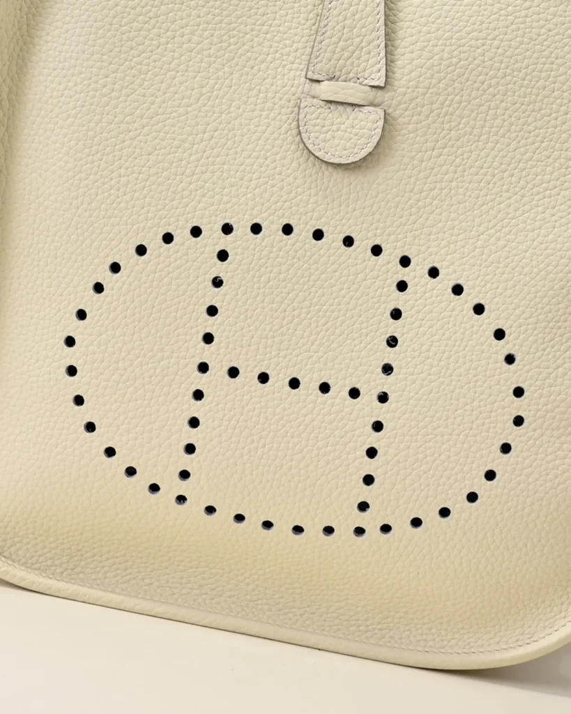 Evelyne-Inspired Ivory Perforated Shoulder Bag, perforated front motif close-up