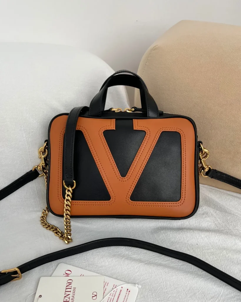 Black and Tan V-Panel Top-Handle Bag — front view