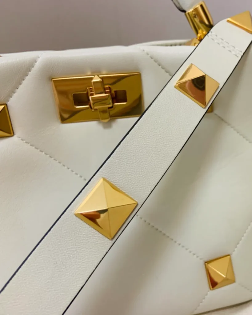 Ivory Diamond-Quilted Studded Top-Handle Bag — strap detail view