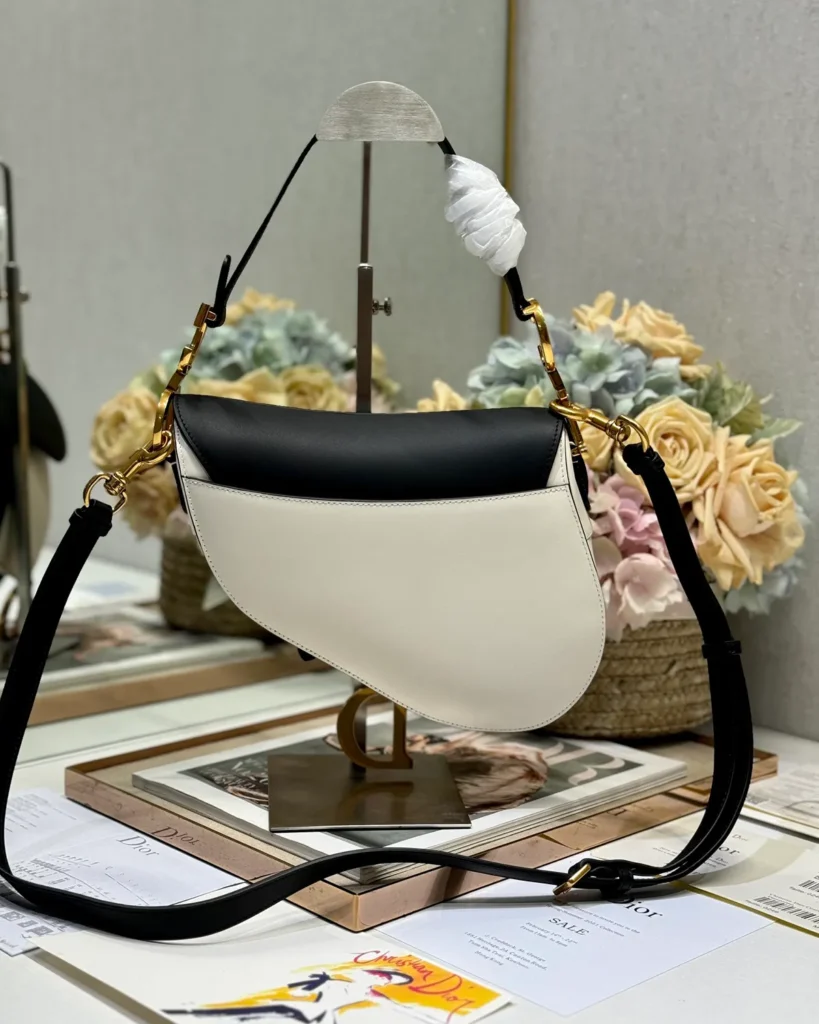 Cream and Black Asymmetric Saddle Bag — rear view