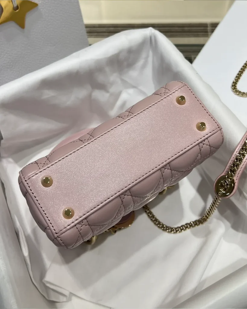 Pearlescent Pink Quilted Top Handle Bag — base view