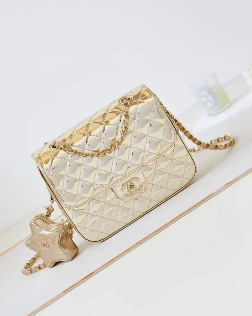 Metallic Gold Quilted Star-Charm Flap Bag — front view