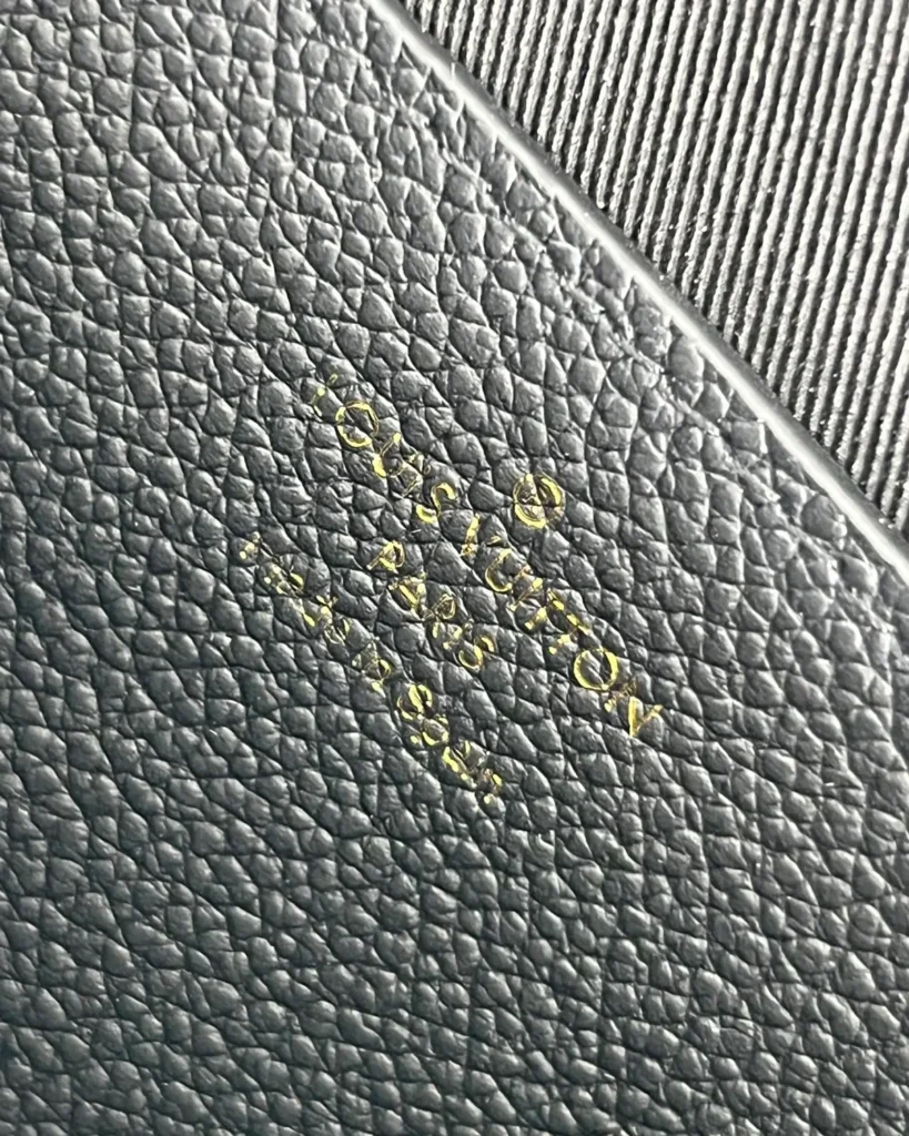 Black Embossed Flap Chain Wallet — interior detail view