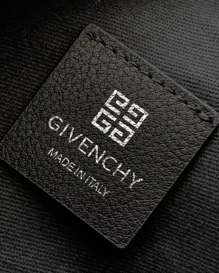 Black Draped-Top Buckle Shoulder Bag — label detail