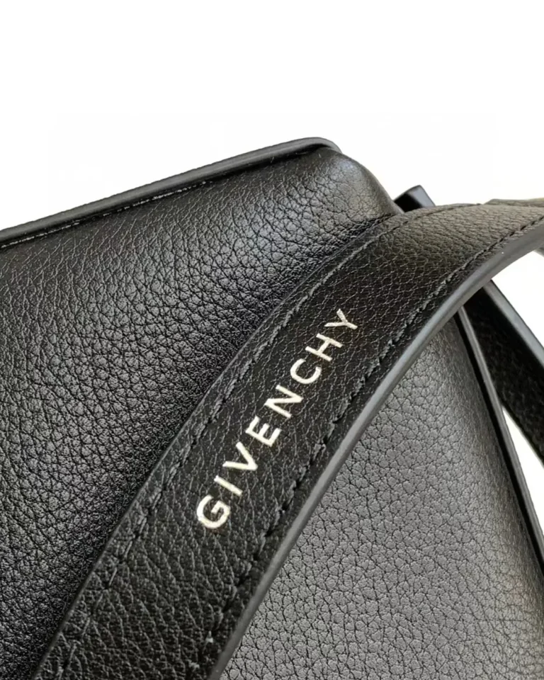 Black Draped-Top Buckle Shoulder Bag — strap lettering