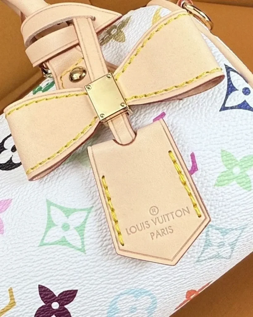 White Multicolor Nano Speedy-Inspired Mini Bag — bow tag detail view
