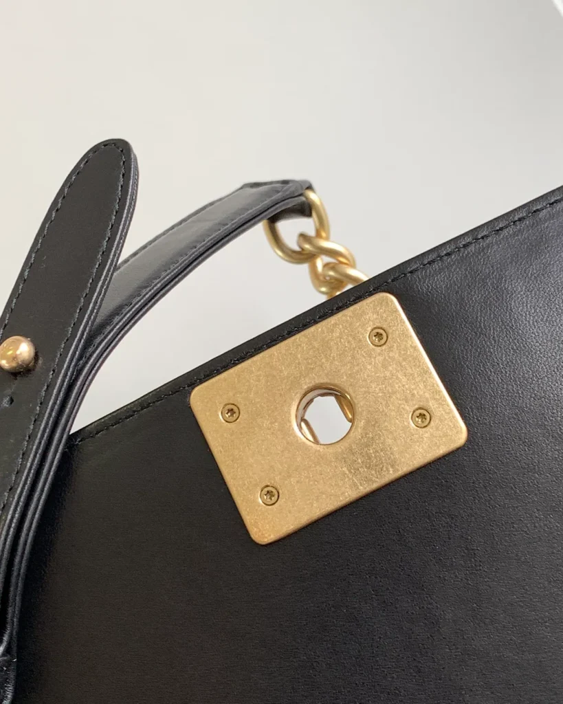 Black Quilted Frame Flap Chain Bag — strap detail view