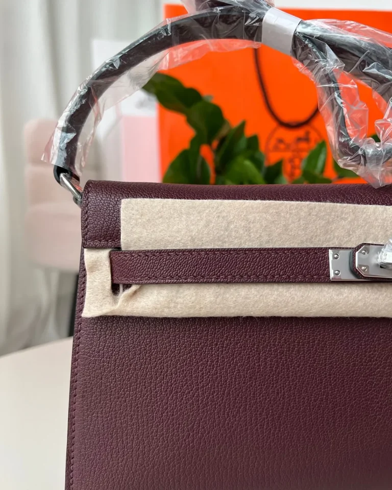 Burgundy structured shoulder bag, front protective wrap view