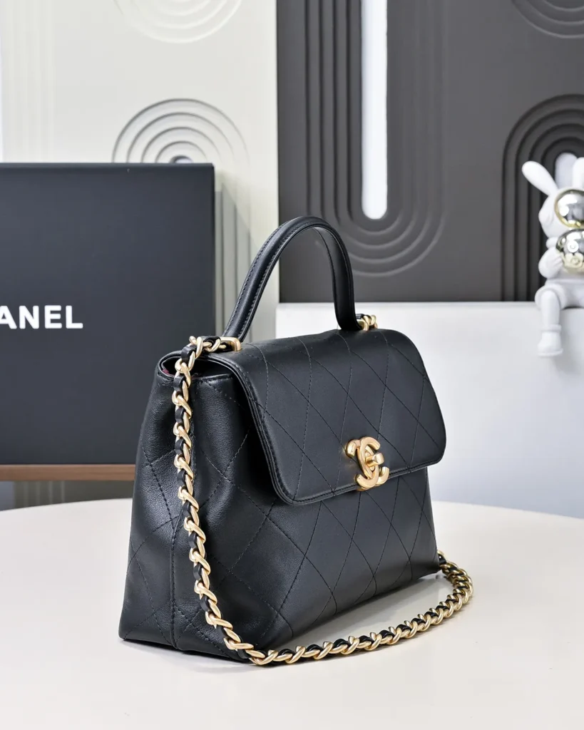 Black Quilted Top-Handle Flap Bag — angled front view