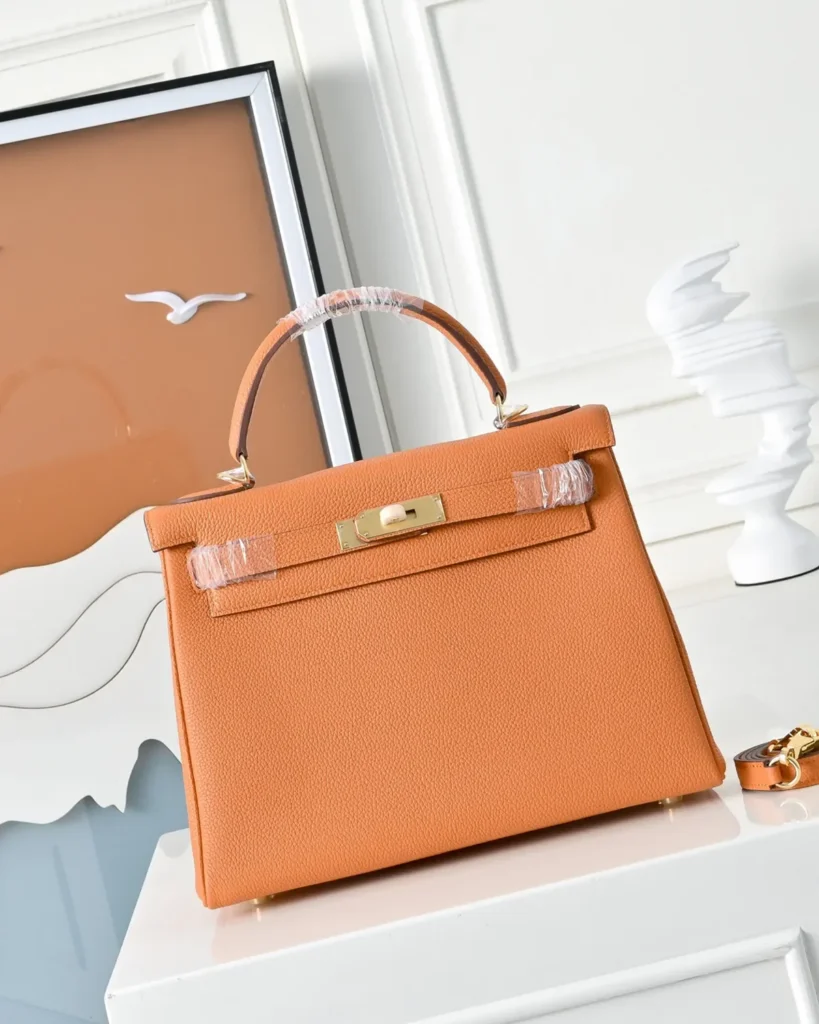 Kelly-Inspired 28 Orange Structured Top-Handle Bag, front display