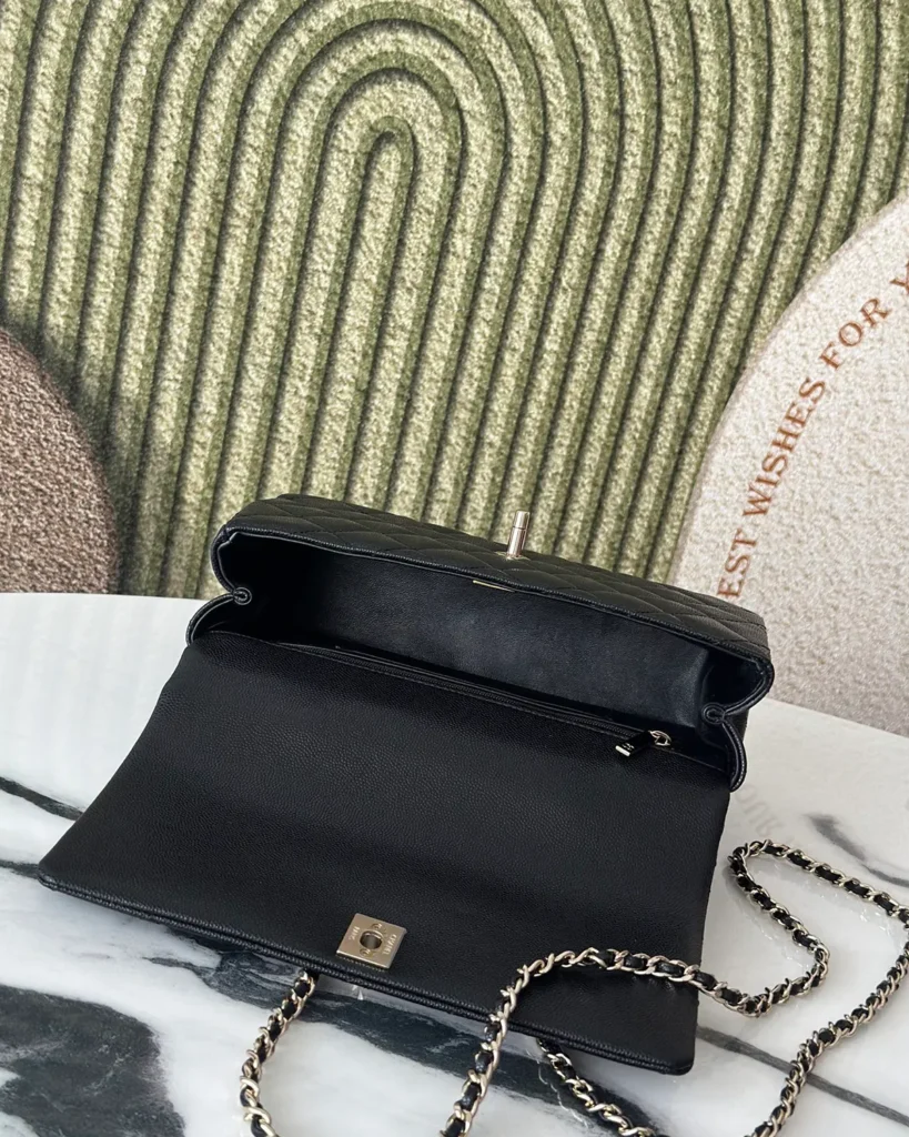 Black Quilted Metal-Handle Flap Bag — interior view
