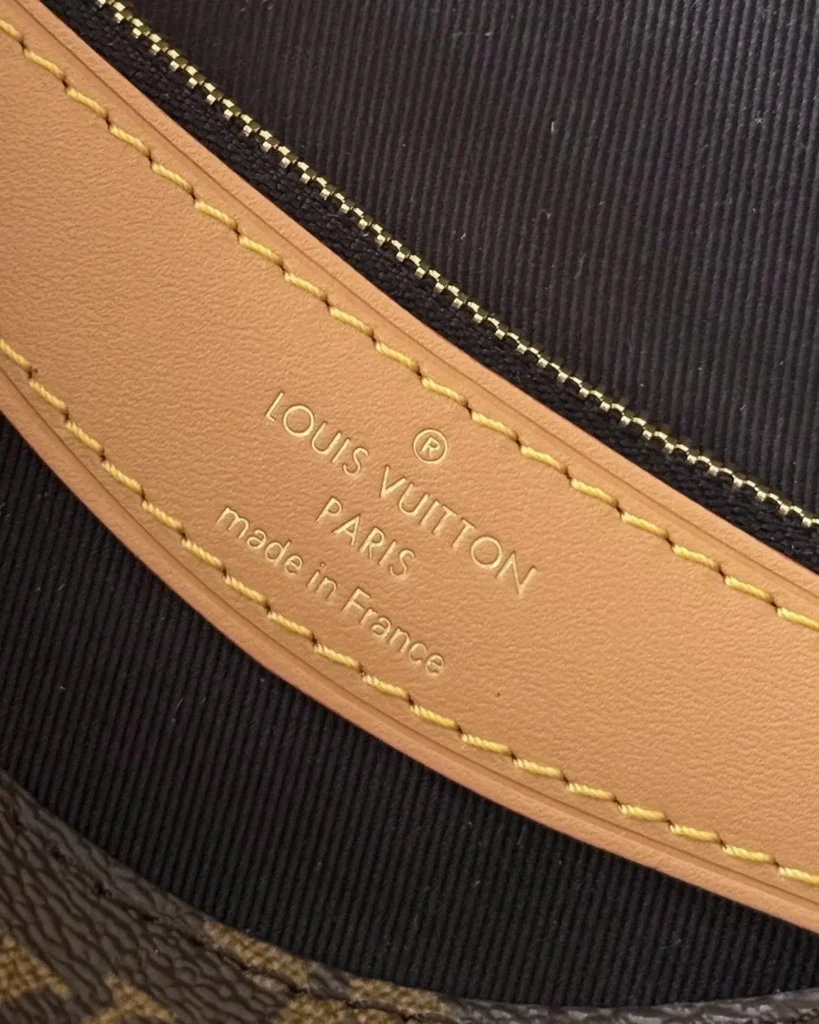 Brown Monogram Buckle Satchel — interior label view