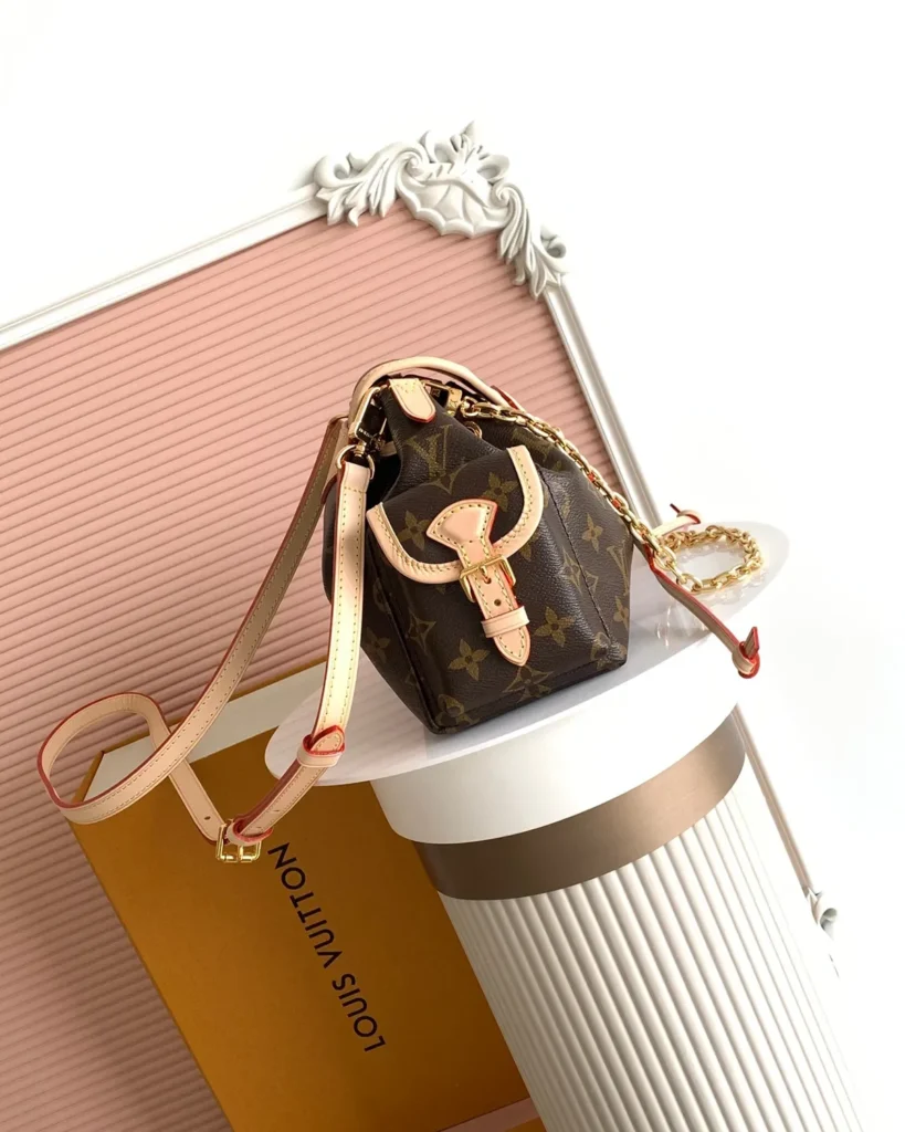 Brown Monogram Buckled Flap Satchel — side view