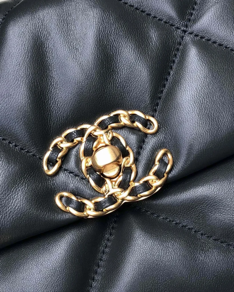 Black Quilted Mixed-Chain Flap Bag — clasp detail view