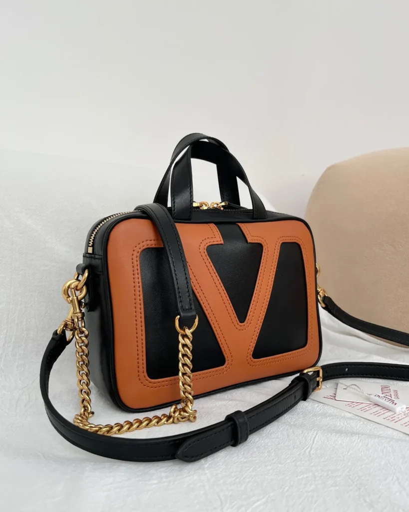 Black and Tan V-Panel Top-Handle Bag — angled front view