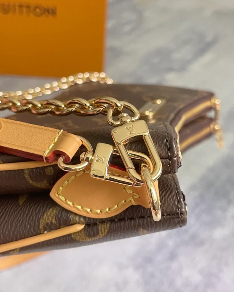 Brown Monogram Curved Zip Chain Pouch — clasp detail view